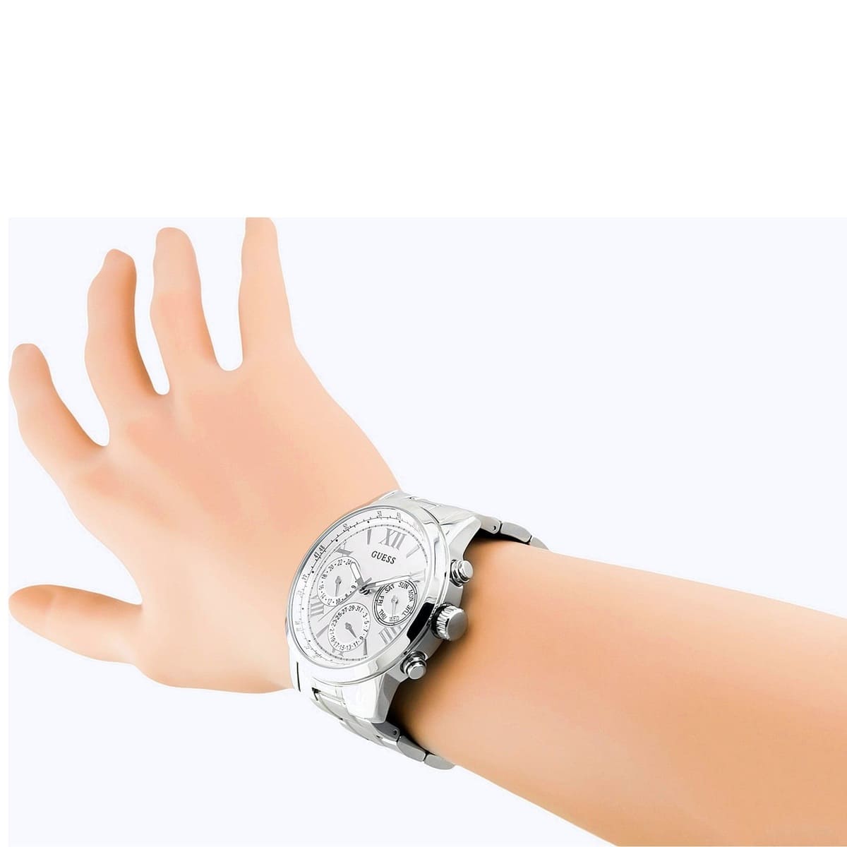 Guess Sunrise multifunction watch worn on wrist showing white chronograph dial and silver bracelet