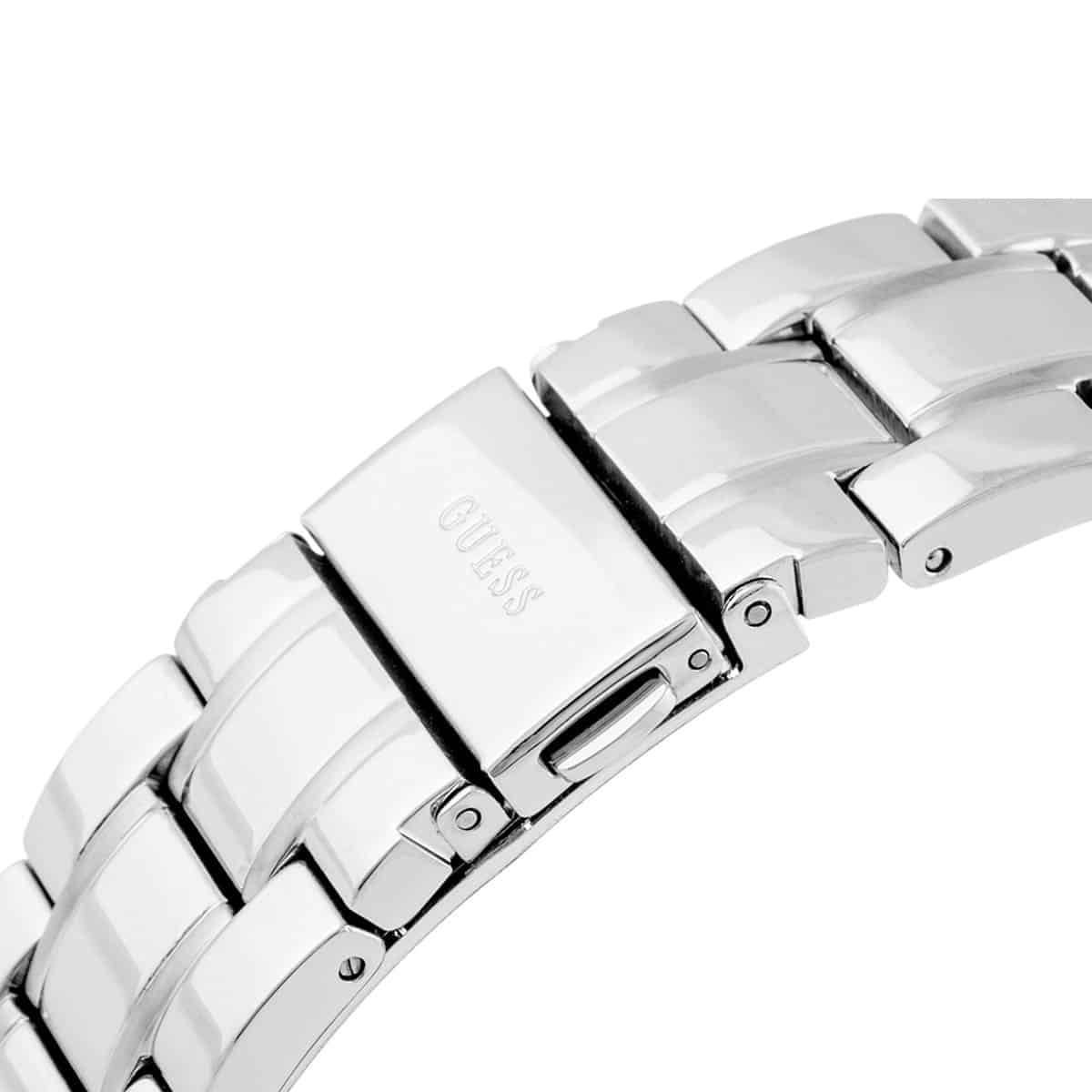 Close-up of silver stainless steel three-link bracelet with Guess logo and fold-over clasp