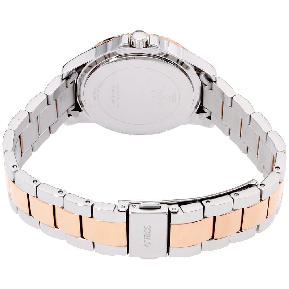 Case back of Guess Mist watch with two-tone stainless steel bracelet visible