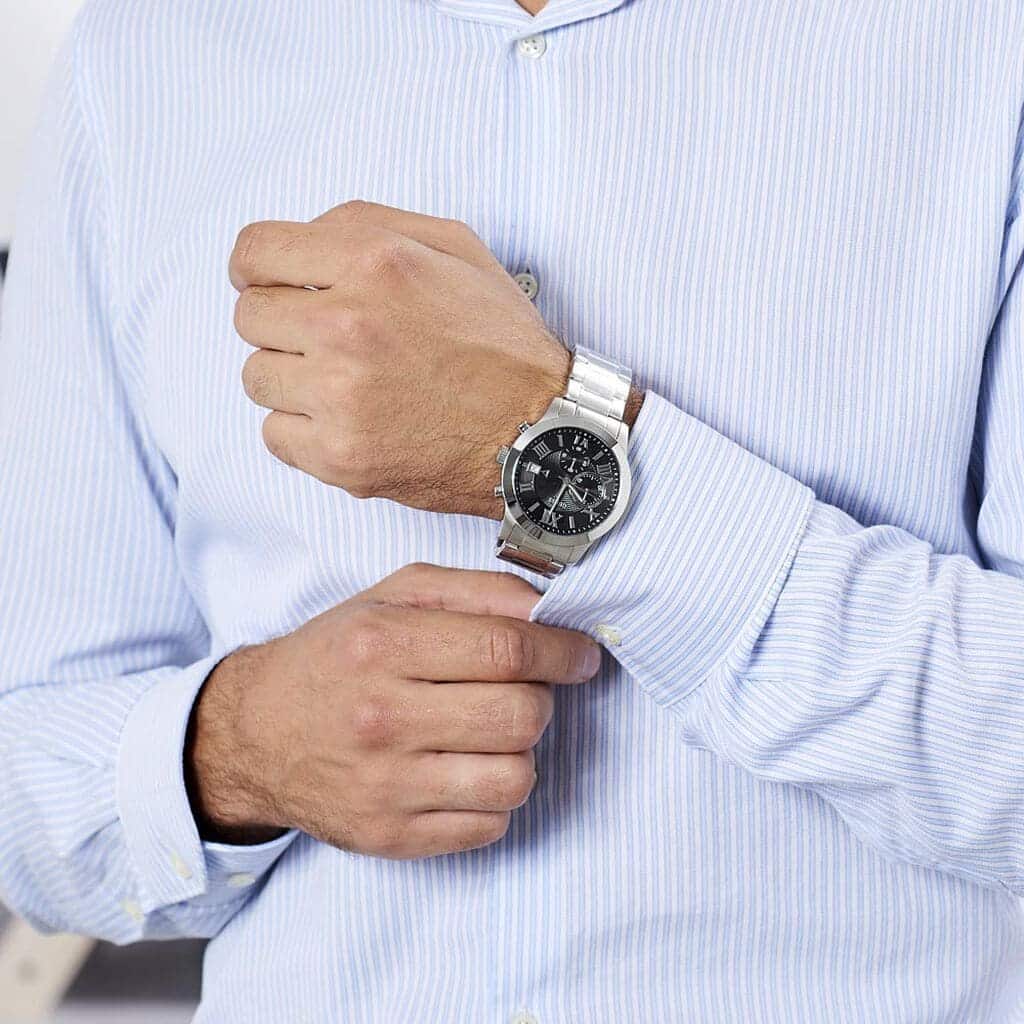 Guess W0668G3 men's chronograph watch styled on wrist with dress shirt