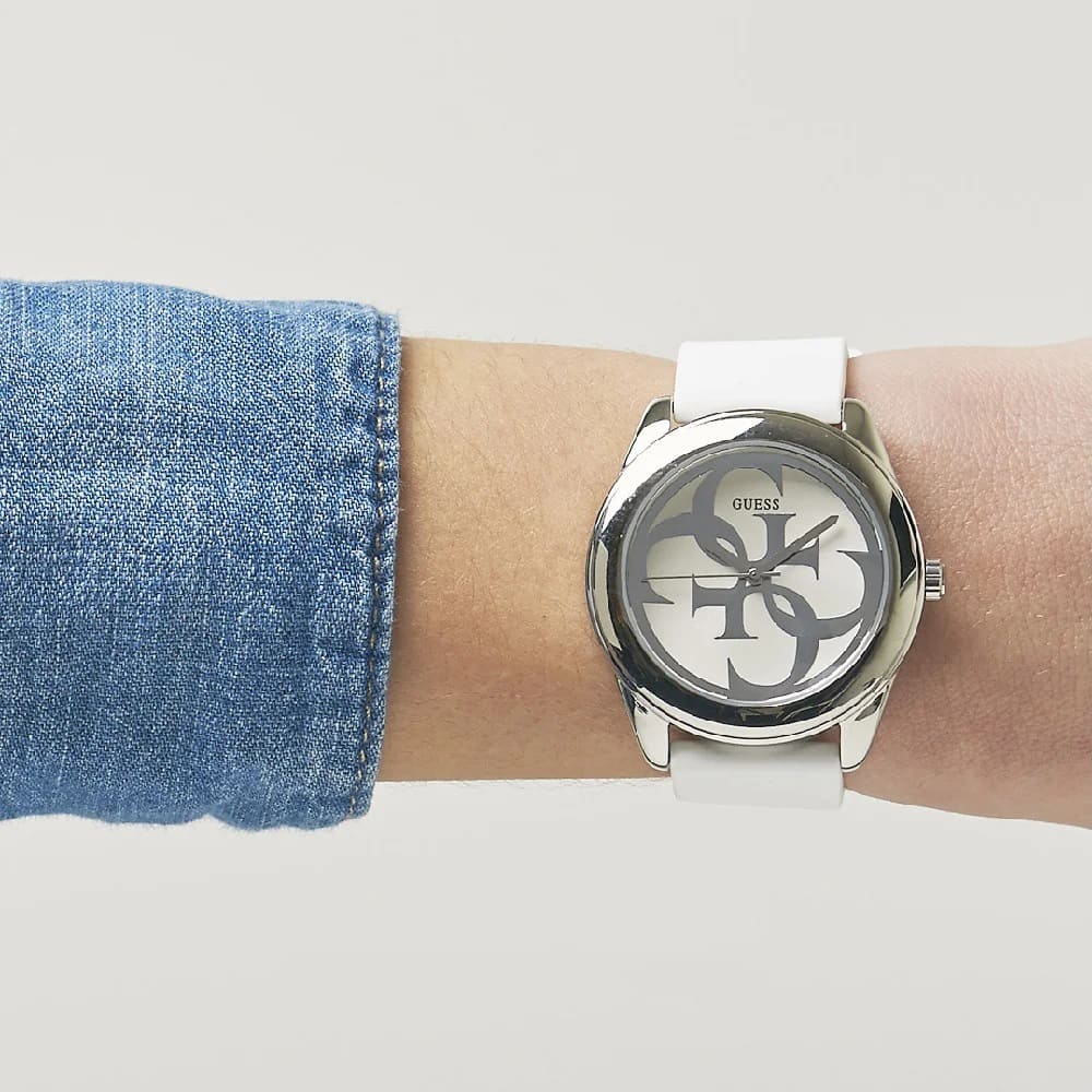 Guess G Twist watch worn on wrist with blue denim and white strap