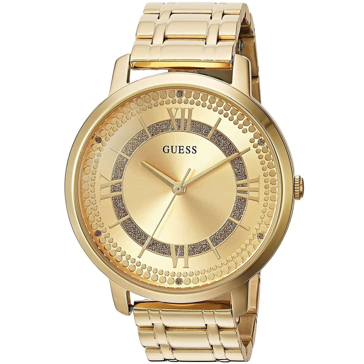 GUESS W0933L2 watch angled view showing gold metal case and crystal-embellished dial with Roman numerals
