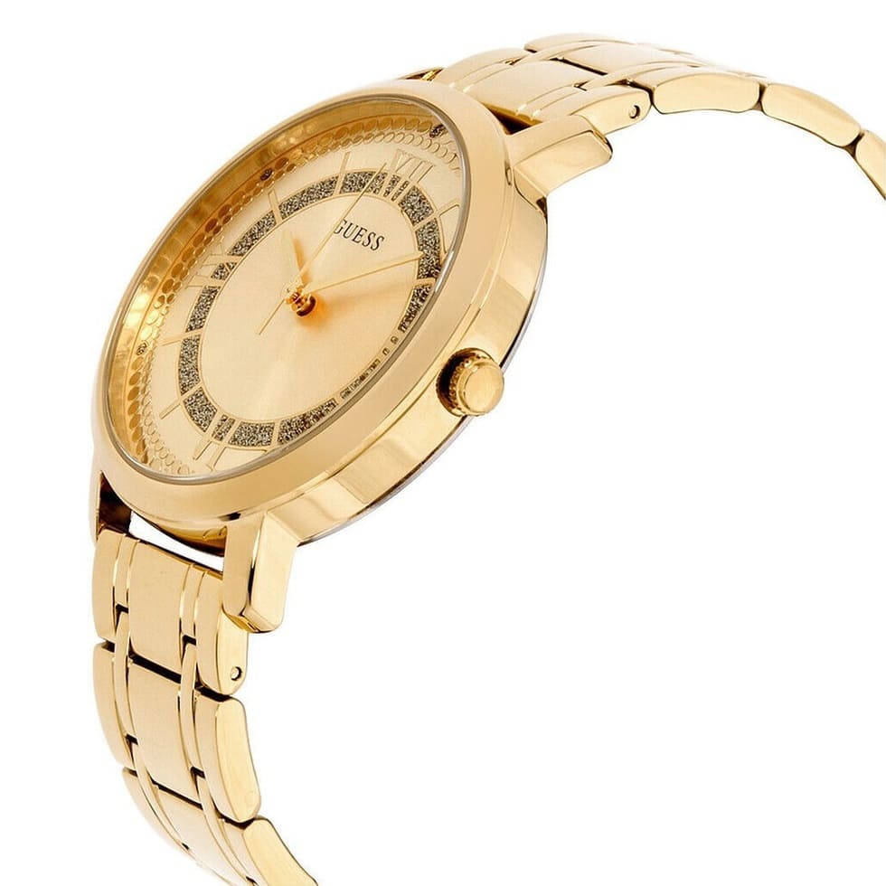 GUESS W0933L2 women's watch side profile with gold metal case and link bracelet