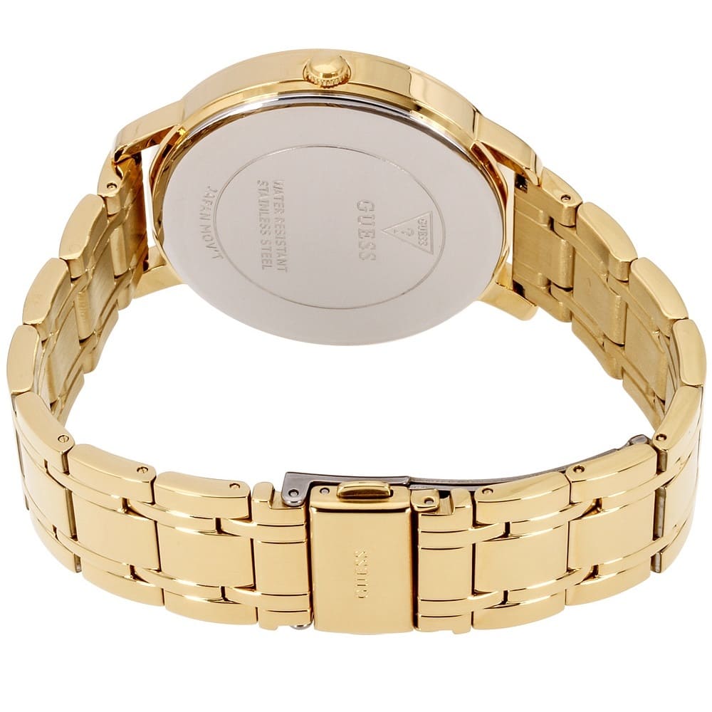 GUESS W0933L2 watch caseback showing gold metal construction and engraved branding