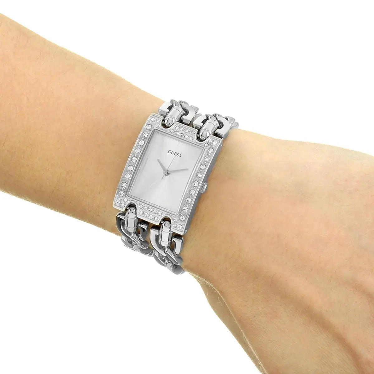 Guess W1121L1 silver women's watch worn on wrist showing square case and chain strap