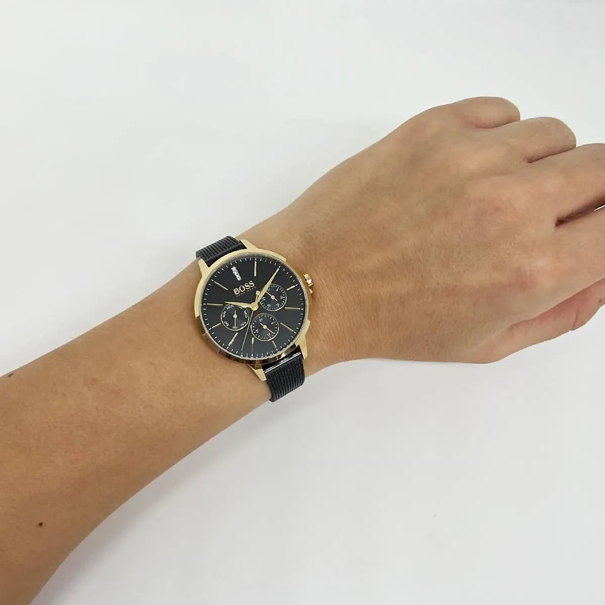 Hugo Boss Symphony watch worn on wrist showing black dial and mesh bracelet fit