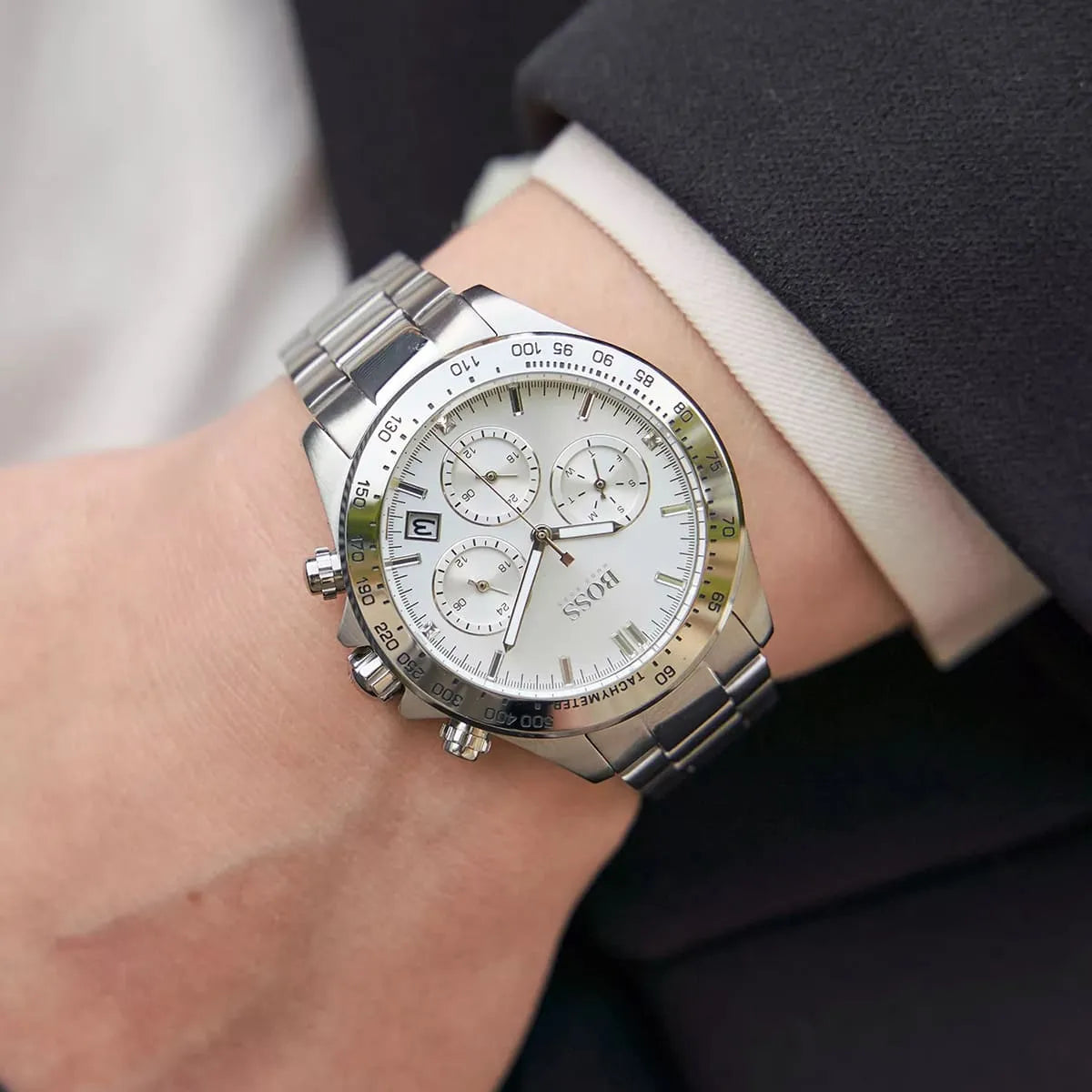 Hugo Boss silver stainless steel chronograph watch worn with business casual clothing