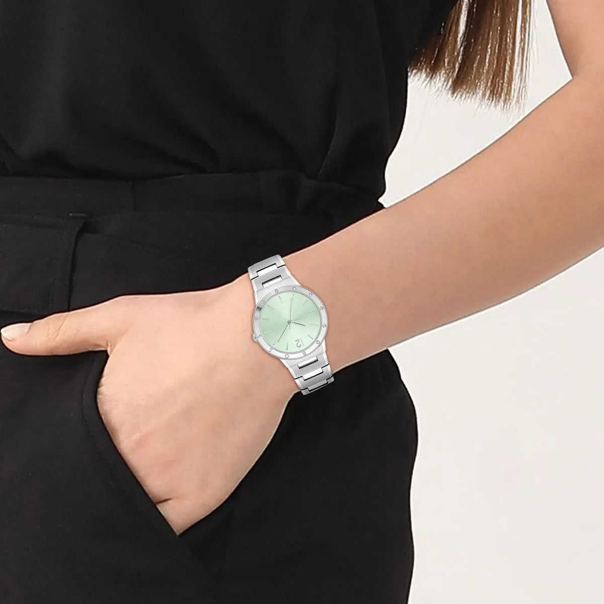 HUGO BOSS women's watch worn on wrist showing green dial and stainless steel bracelet styling
