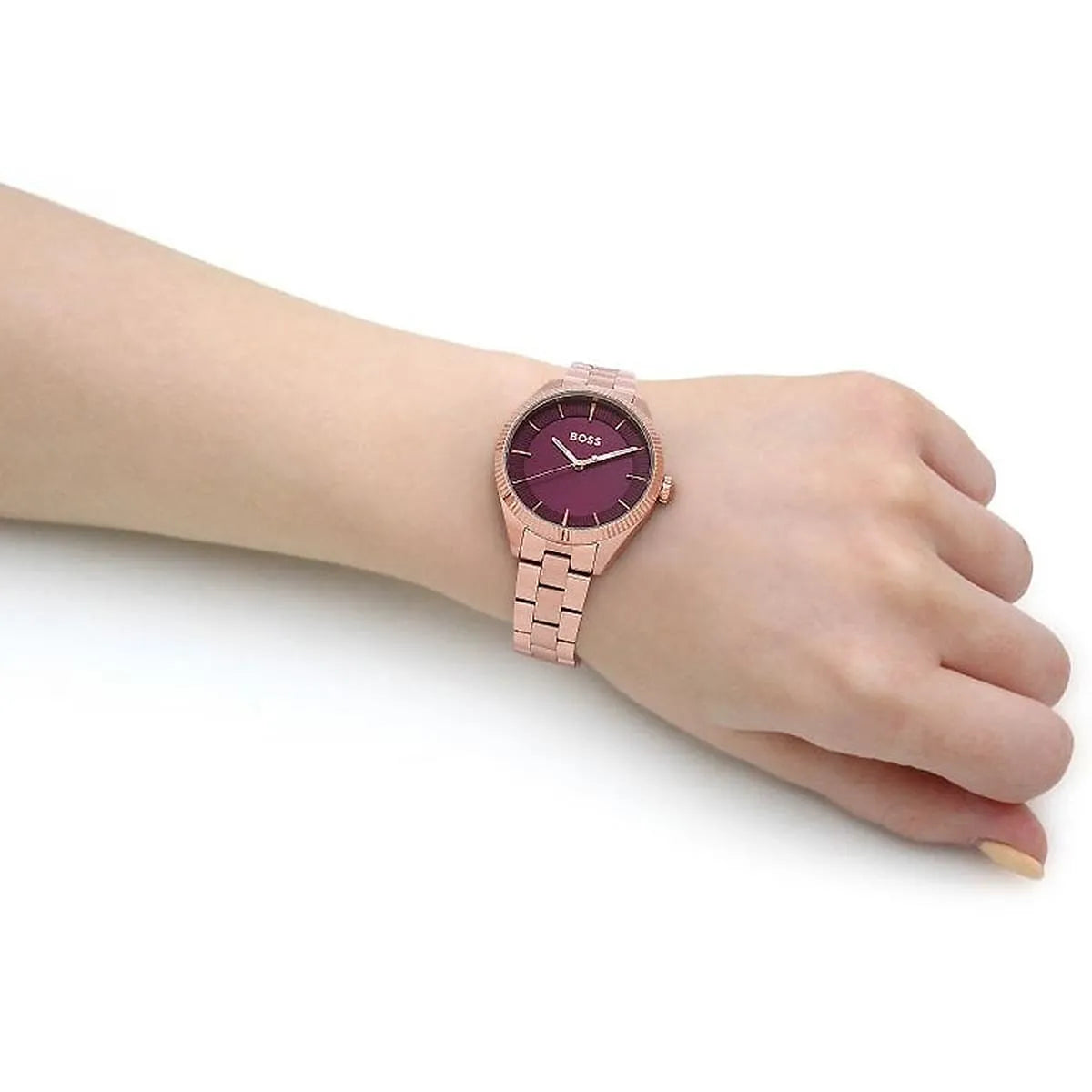 Hugo Boss Sage women's watch on wrist showing purple dial and rose gold strap