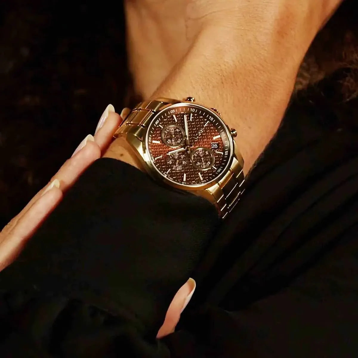 Hugo Boss Grand Tour women's chronograph watch worn on wrist showing brown dial and gold-tone bracelet