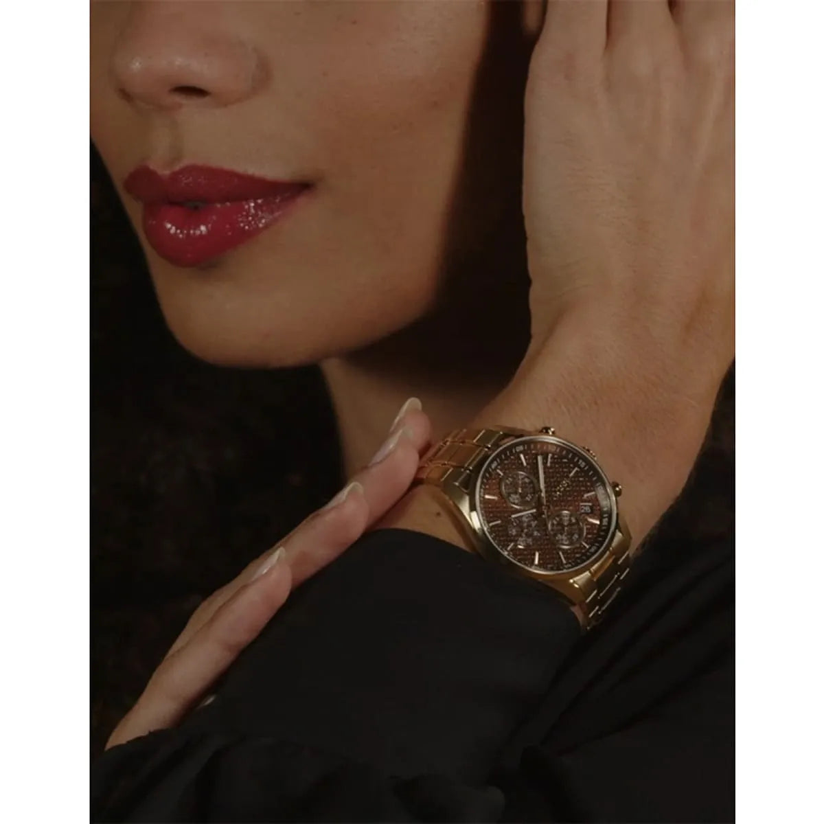 Hugo Boss Grand Tour watch on wrist featuring brown multifunction dial and gold-tone stainless steel