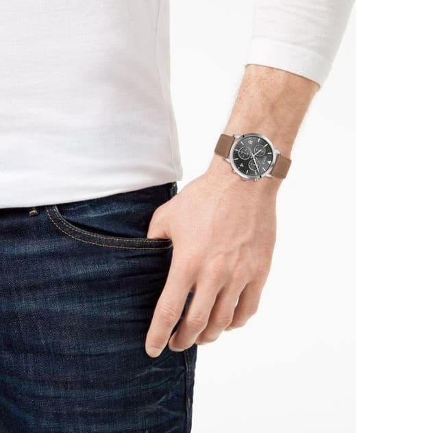 Hugo Boss chronograph watch worn on wrist with brown leather band