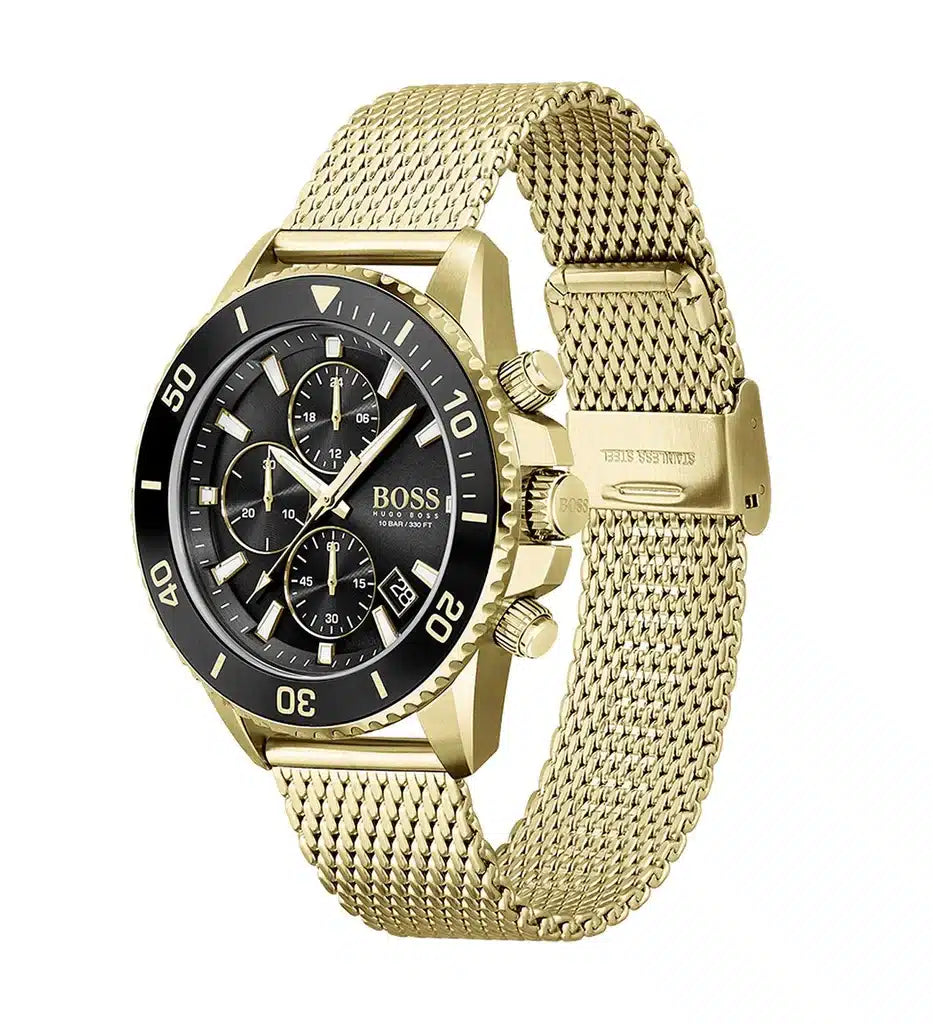 A Hugo Boss men's watch featuring a gold-tone stainless steel mesh bracelet, a gold-tone case, and a black dial with chronograph sub-dials and a black bezel.