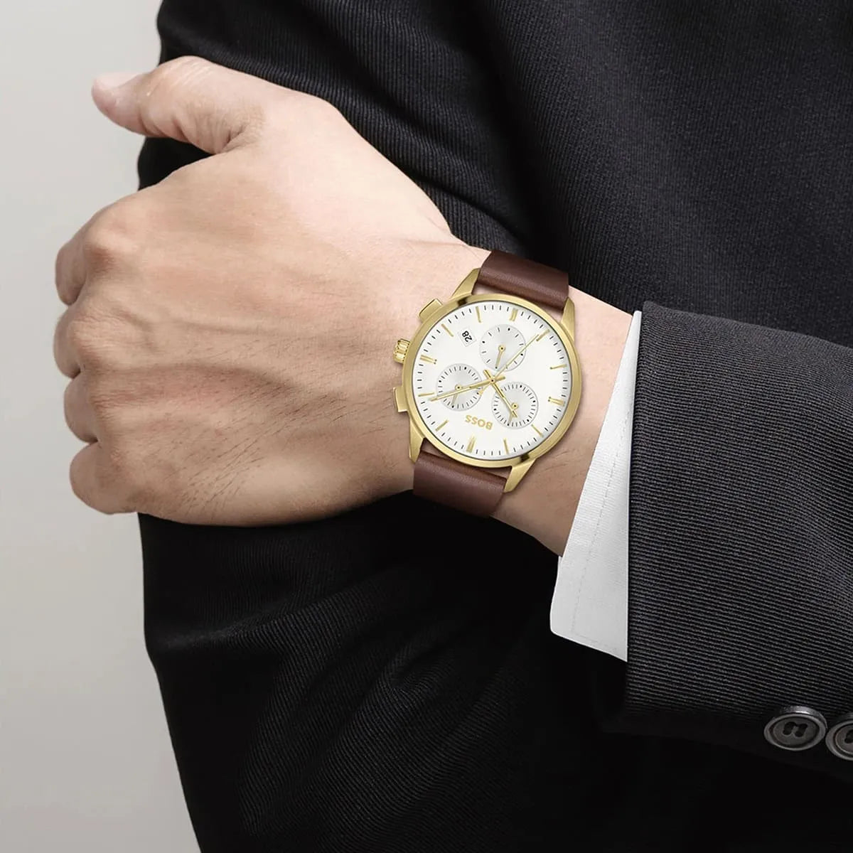 Hugo Boss Dapper chronograph watch worn on wrist with brown leather strap