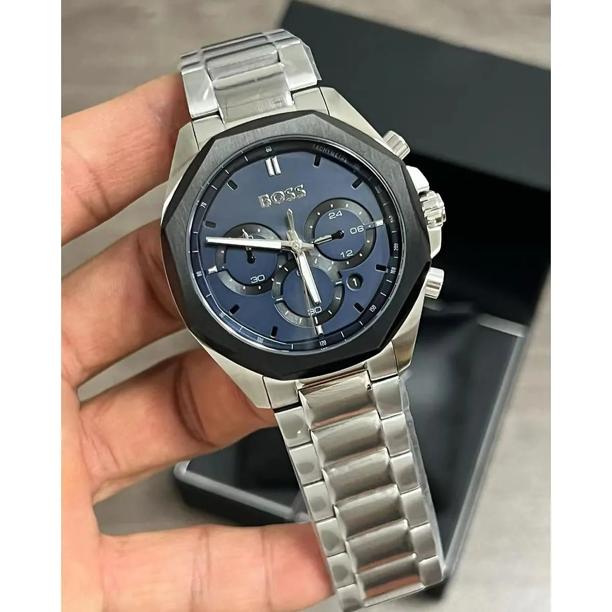 Hugo Boss Cloud chronograph watch with navy dial and stainless steel bracelet in hand