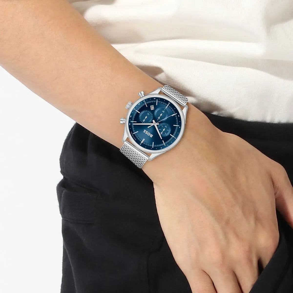 Hugo Boss Gregor watch with blue dial displayed on wrist with silver mesh strap