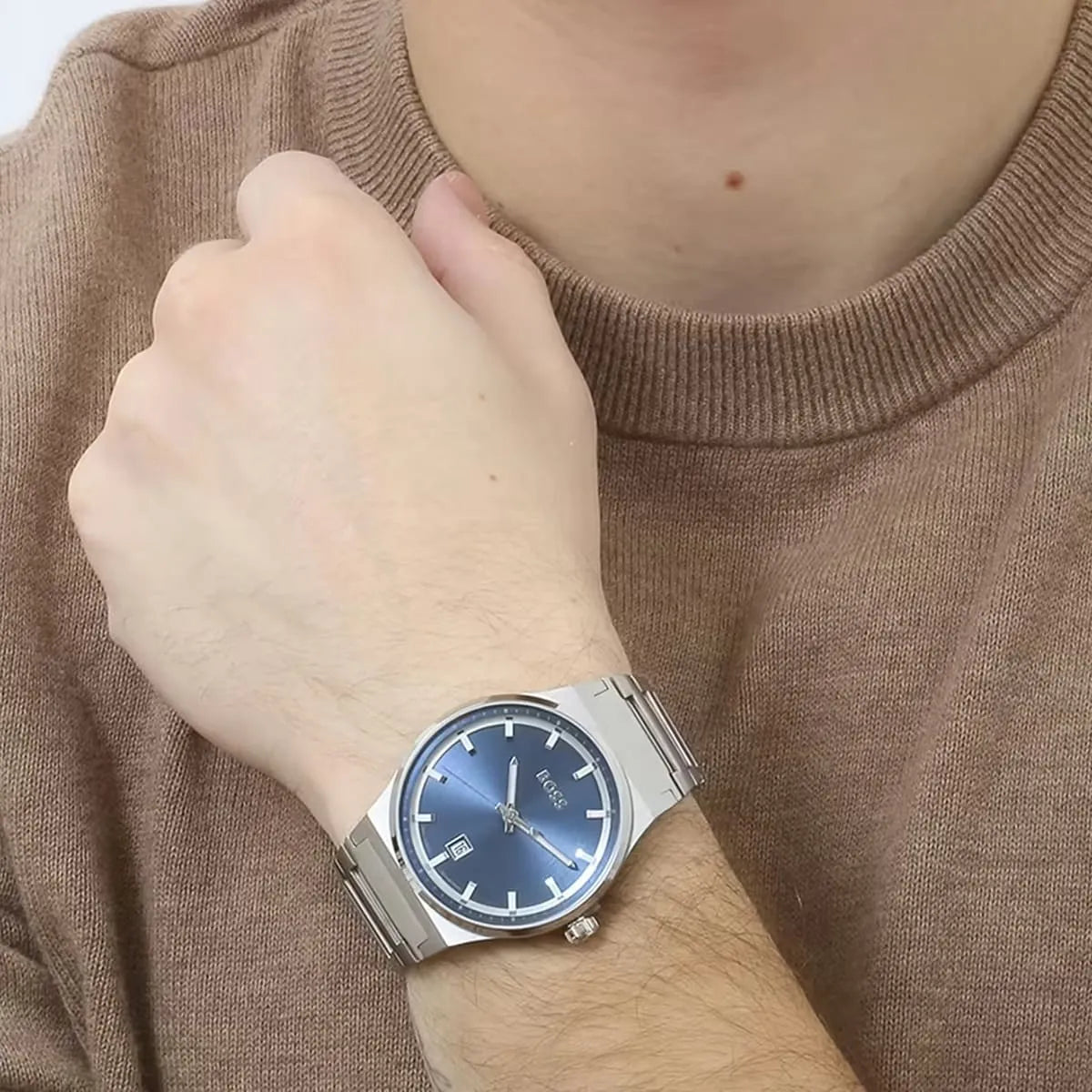 Hugo Boss Candor watch worn on wrist with blue dial visible
