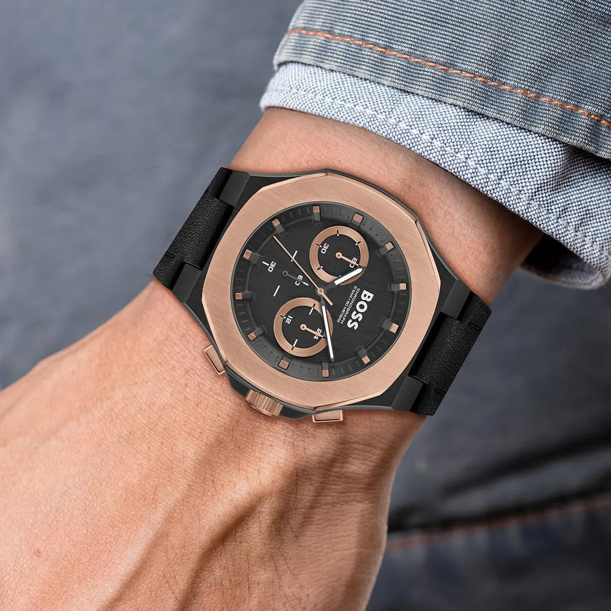 Hugo Boss Taper men's chronograph on wrist showing black leather strap and rose gold bezel