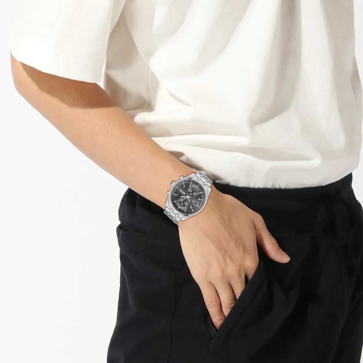 Hugo Boss Skytraveller chronograph watch worn on male wrist with white shirt