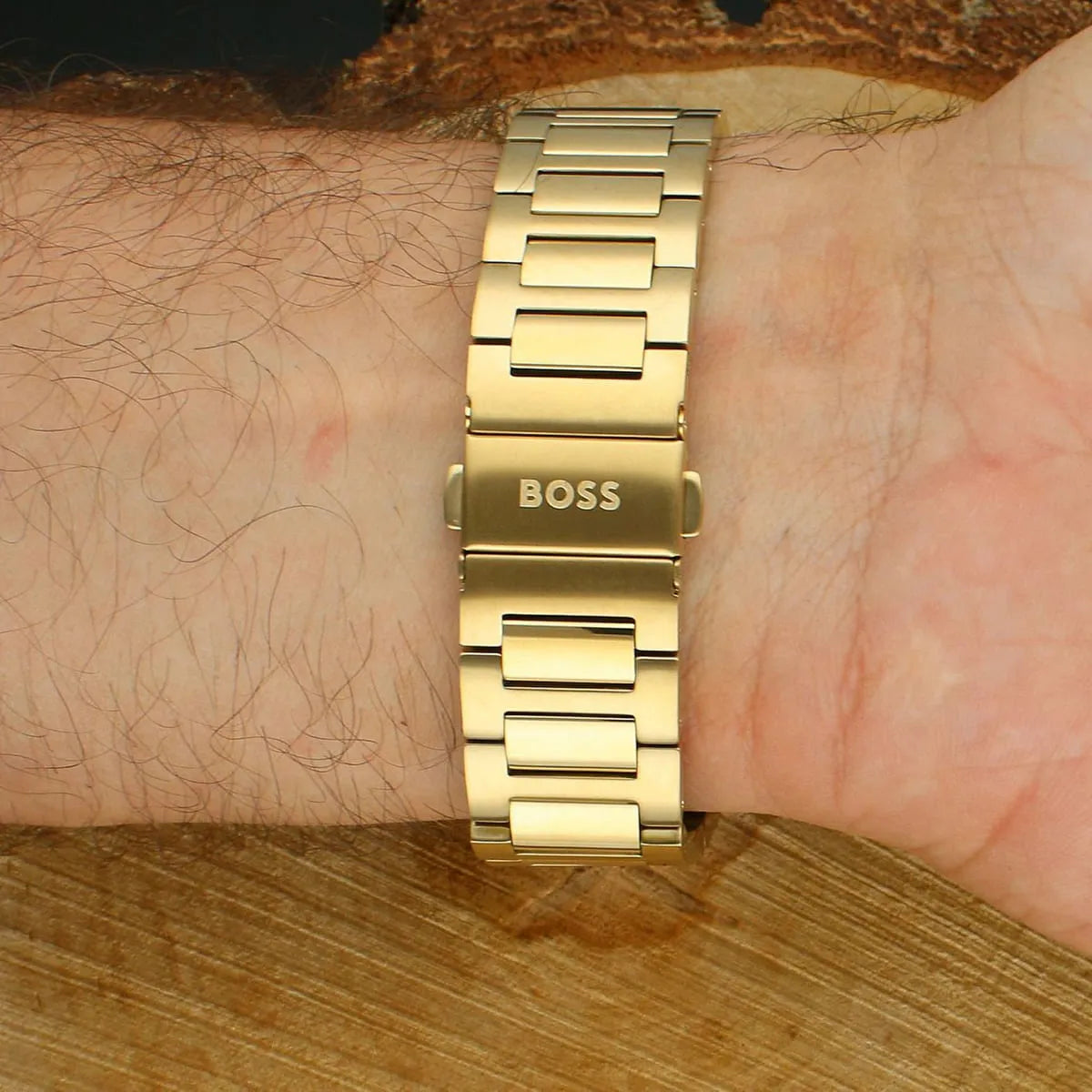 Hugo Boss Strike gold stainless steel bracelet closeup worn on wrist