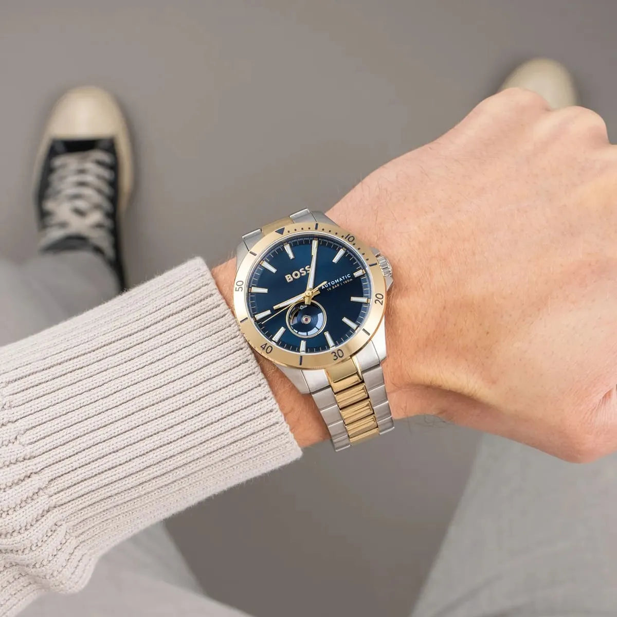 Hugo Boss Troper automatic watch worn on wrist showing navy dial and two-tone bracelet