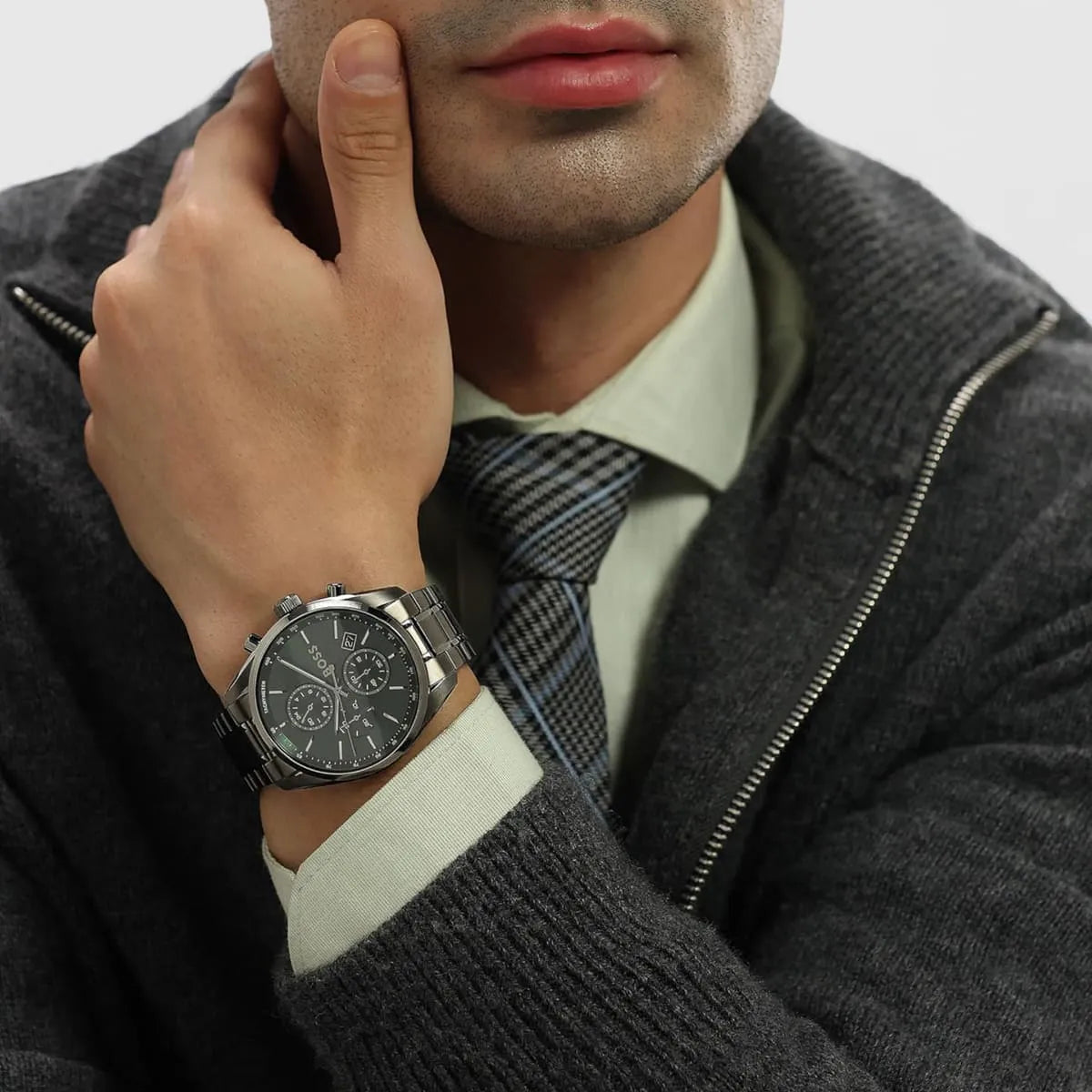 Hugo Boss Grand Prix watch on wrist lifestyle shot with grey sweater and jacket