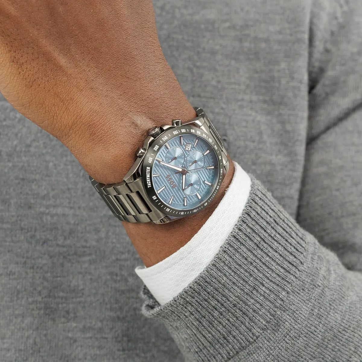 Hugo Boss Strike chronograph watch worn on wrist with gray sweater
