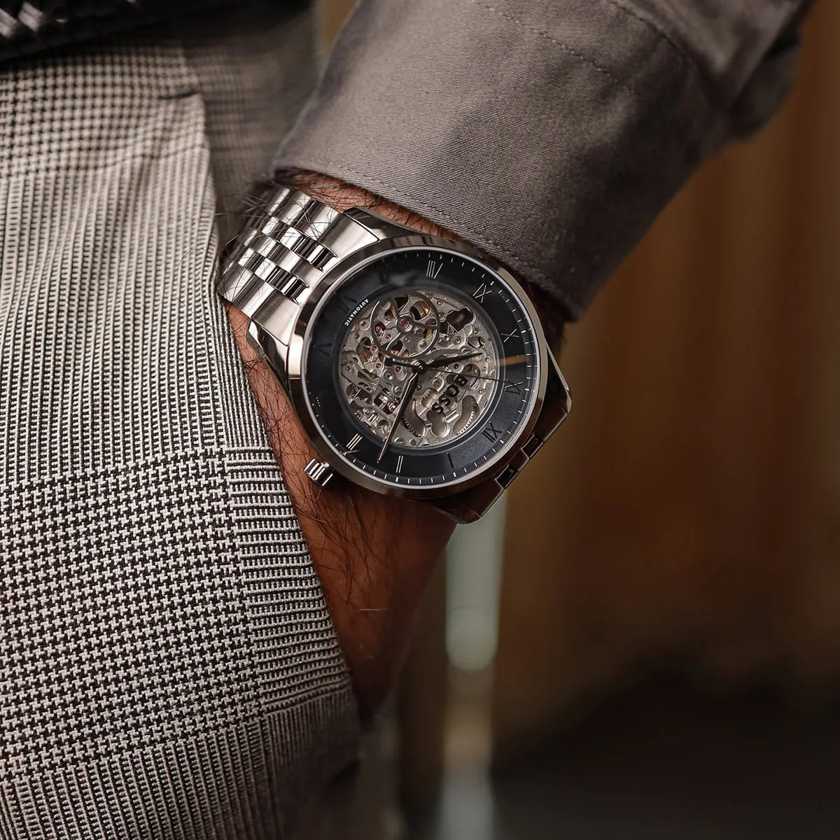 Hugo Boss Principle skeleton men's watch on wrist with visible exposed movement dial