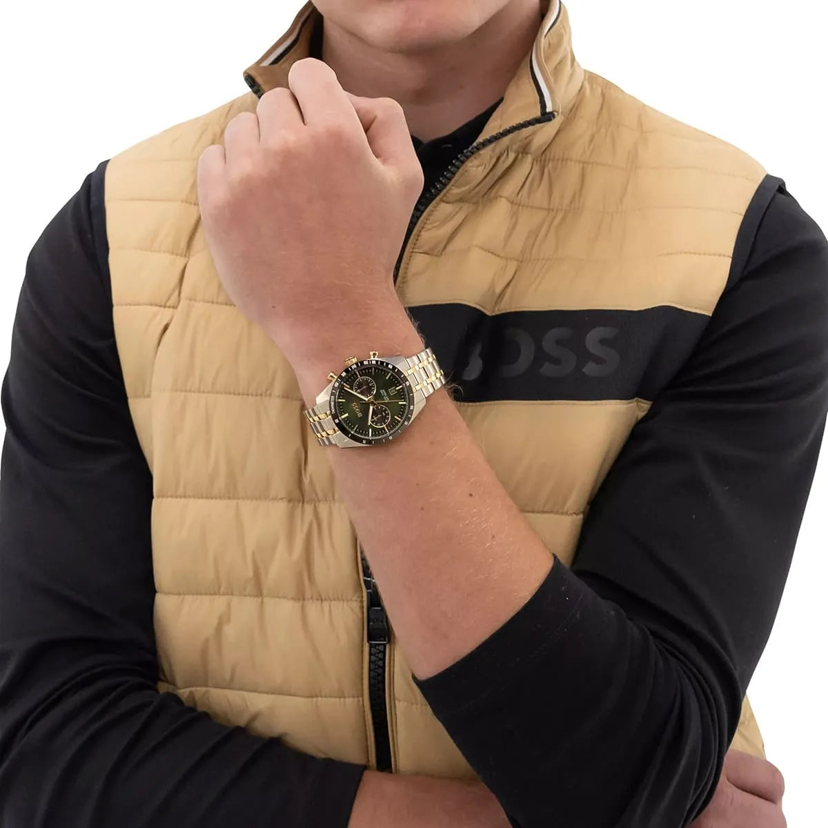 Hugo Boss Tourmaster men's chronograph watch on wrist showing green dial and gold-tone accents