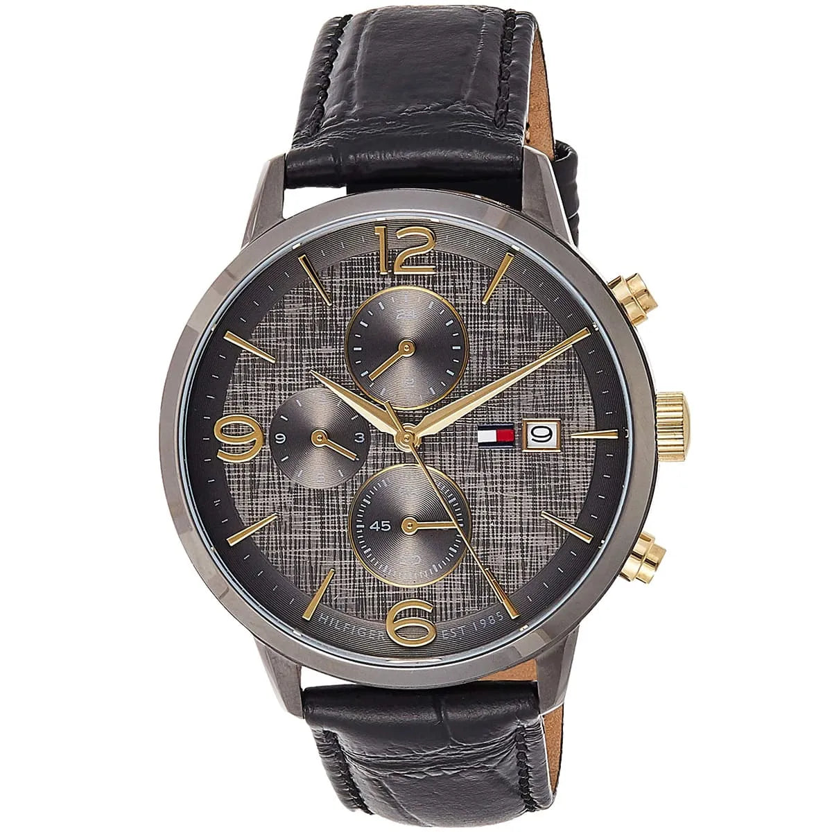 Angled view of Tommy Hilfiger Liam watch showing gray chronograph dial with gold accents and black leather strap