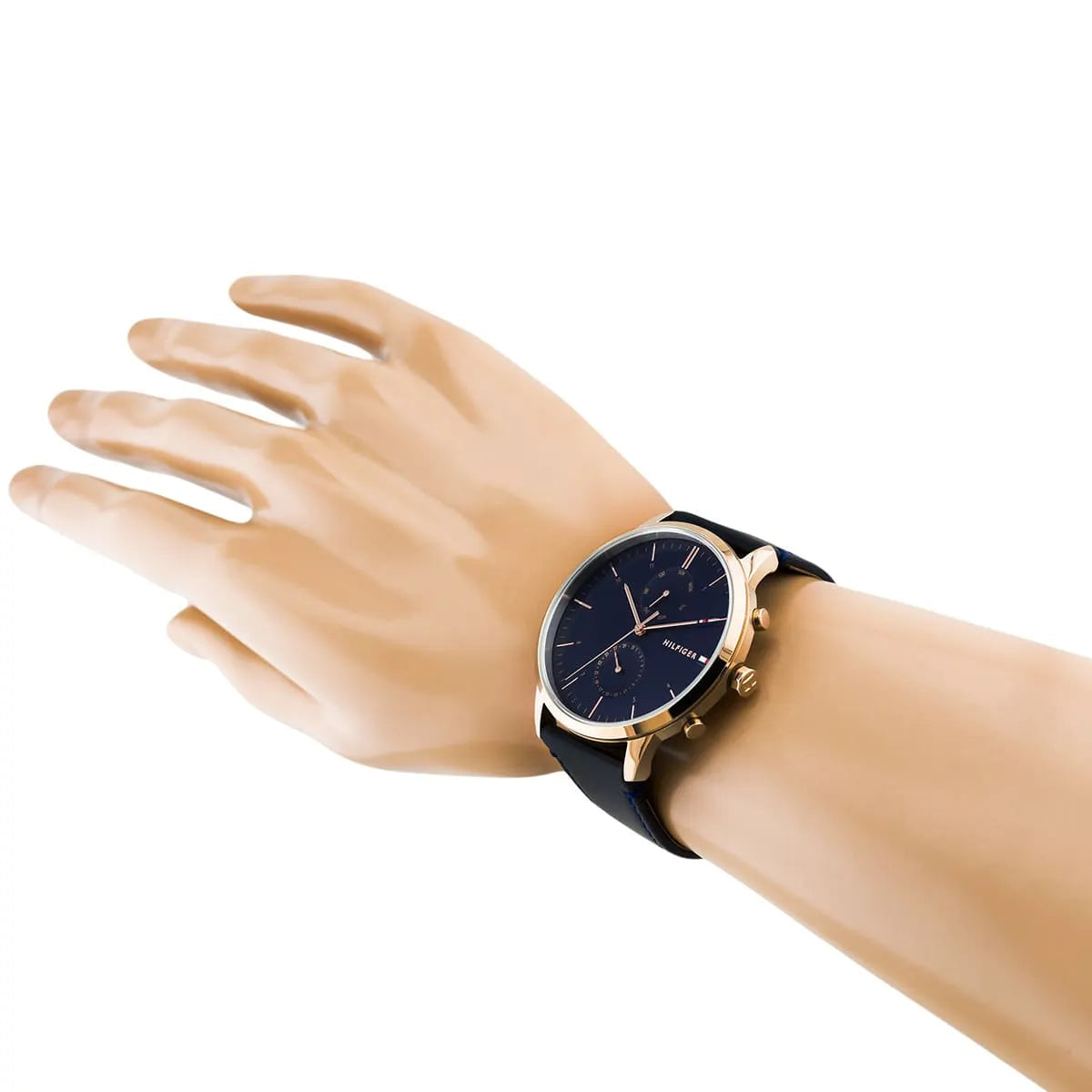 Tommy Hilfiger Hunter watch worn on wrist showing blue dial with subdials and rose gold casing