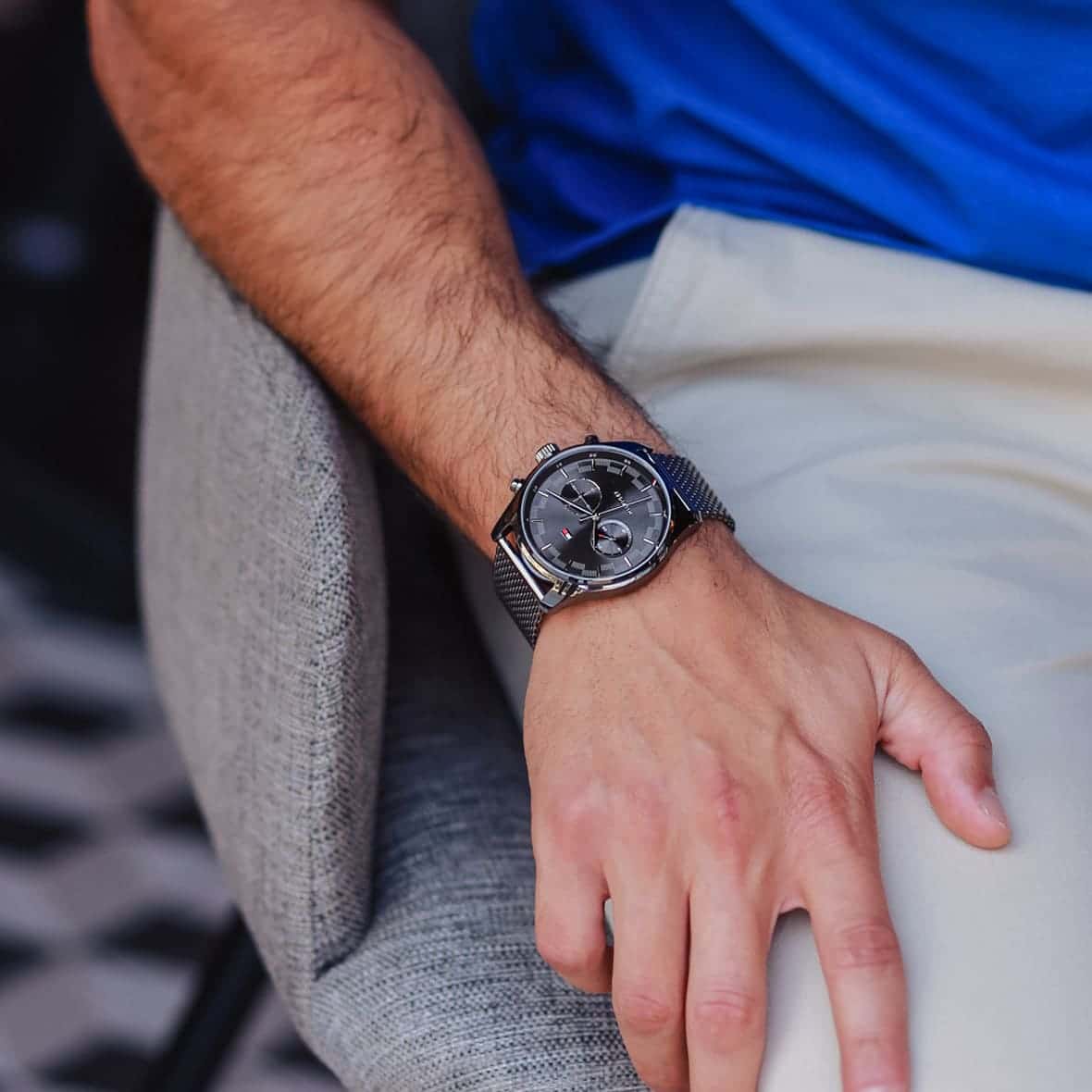 Tommy Hilfiger Sawyer chronograph watch on wrist showing grey dial and mesh strap