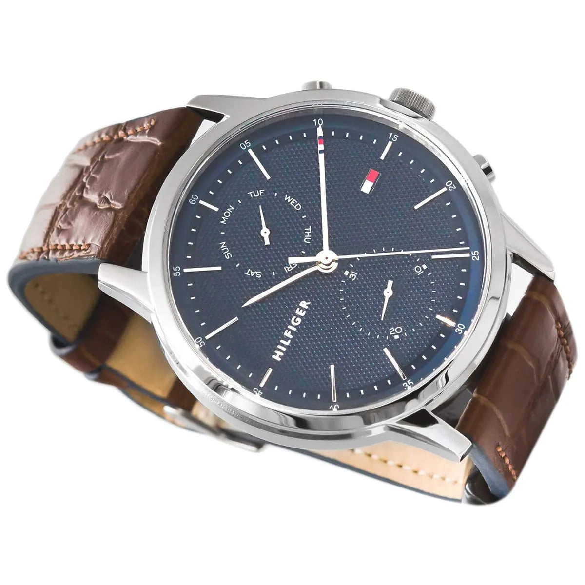 Detailed view of navy chronograph dial with chronograph subdials and hand indices