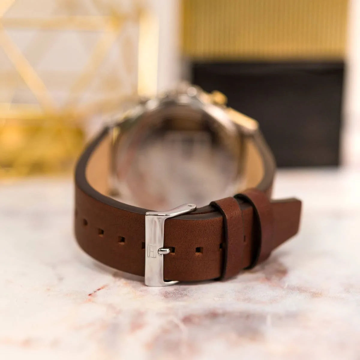 Tommy Hilfiger Ryder watch with packaging on styled background