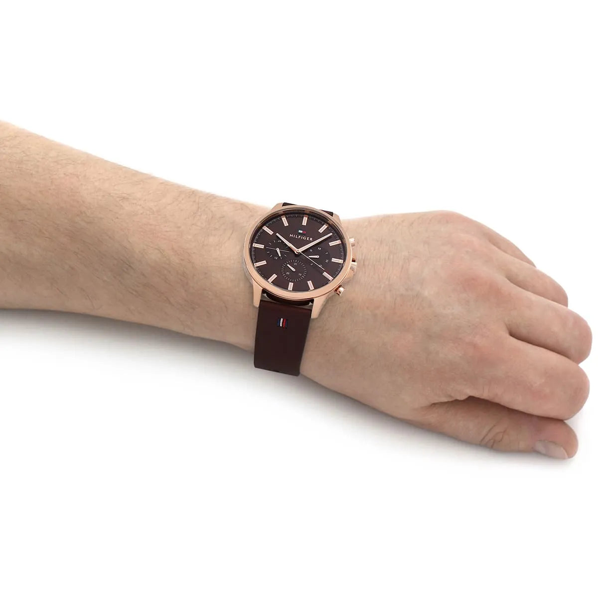 Ryder chronograph watch worn on wrist showing rose gold case and brown leather strap fit
