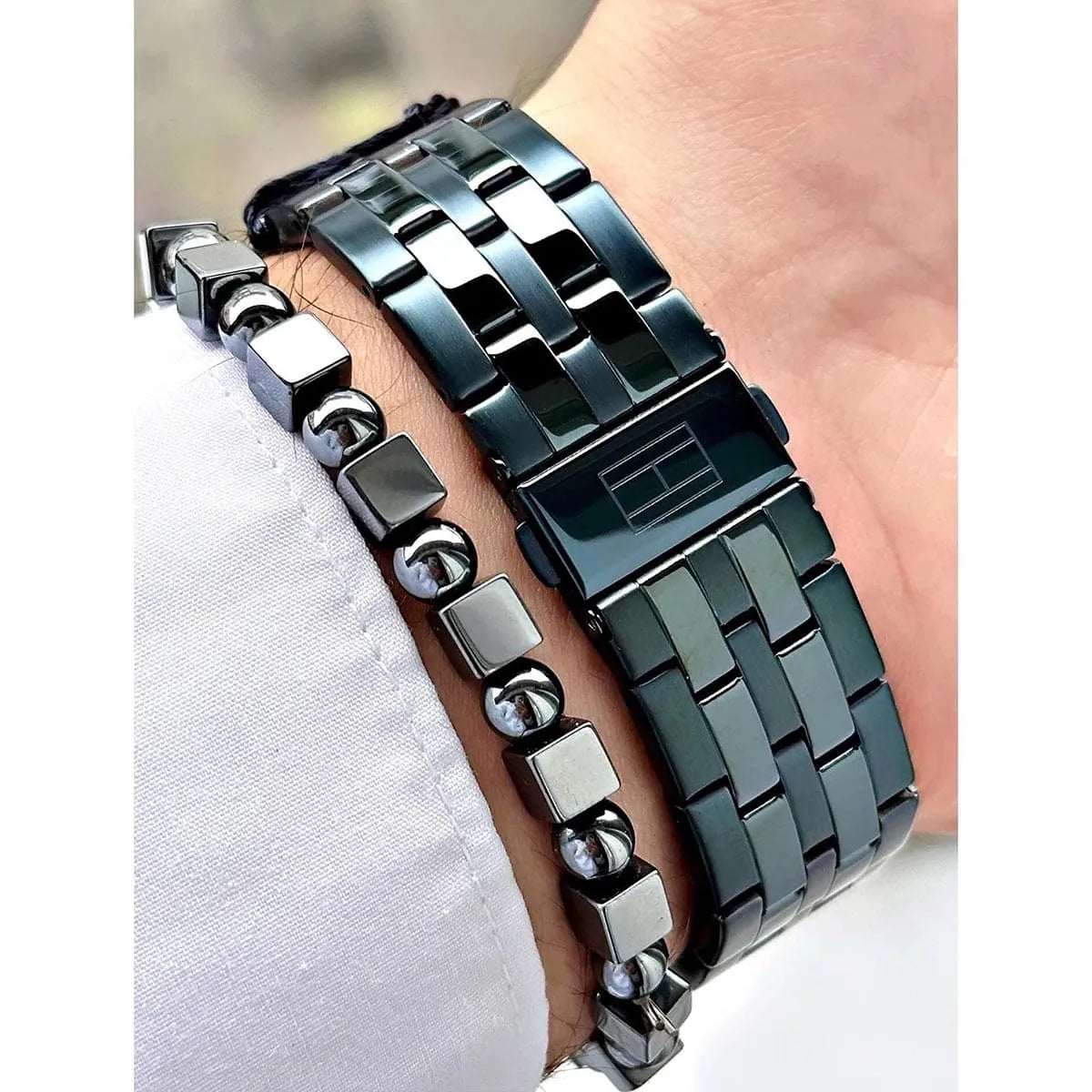 Close-up of Tommy Hilfiger Damon stainless steel link bracelet showing block-link design