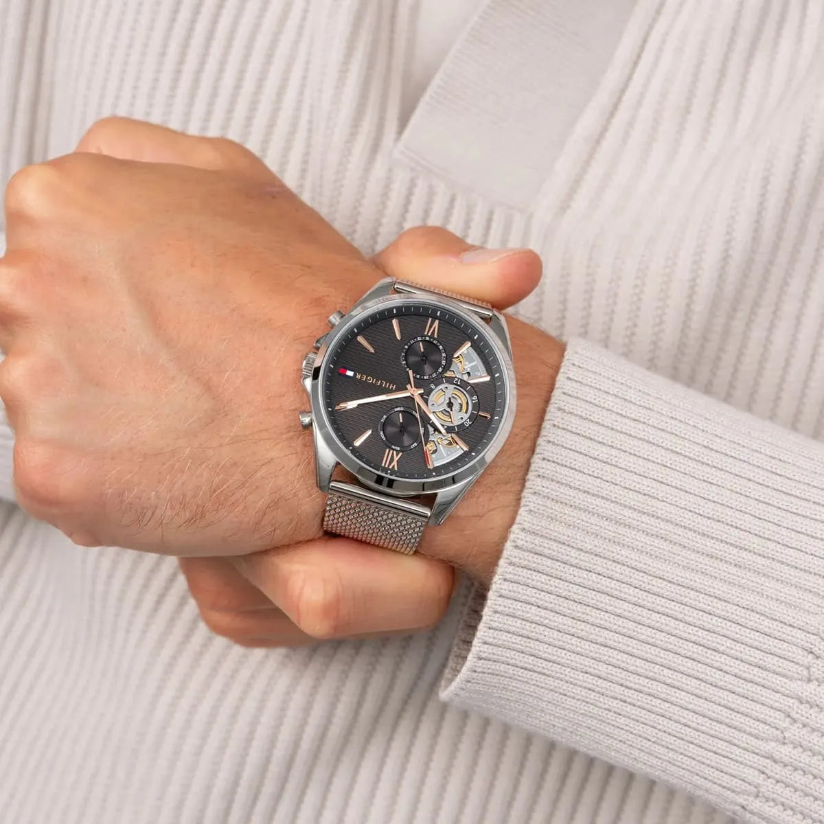 Tommy Hilfiger Baker men's watch worn on wrist with gray dial and visible chronograph subdials