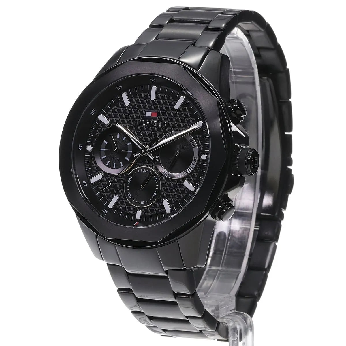 Tommy Hilfiger Lars watch three-quarter view displaying black case, textured dial, and steel bracelet
