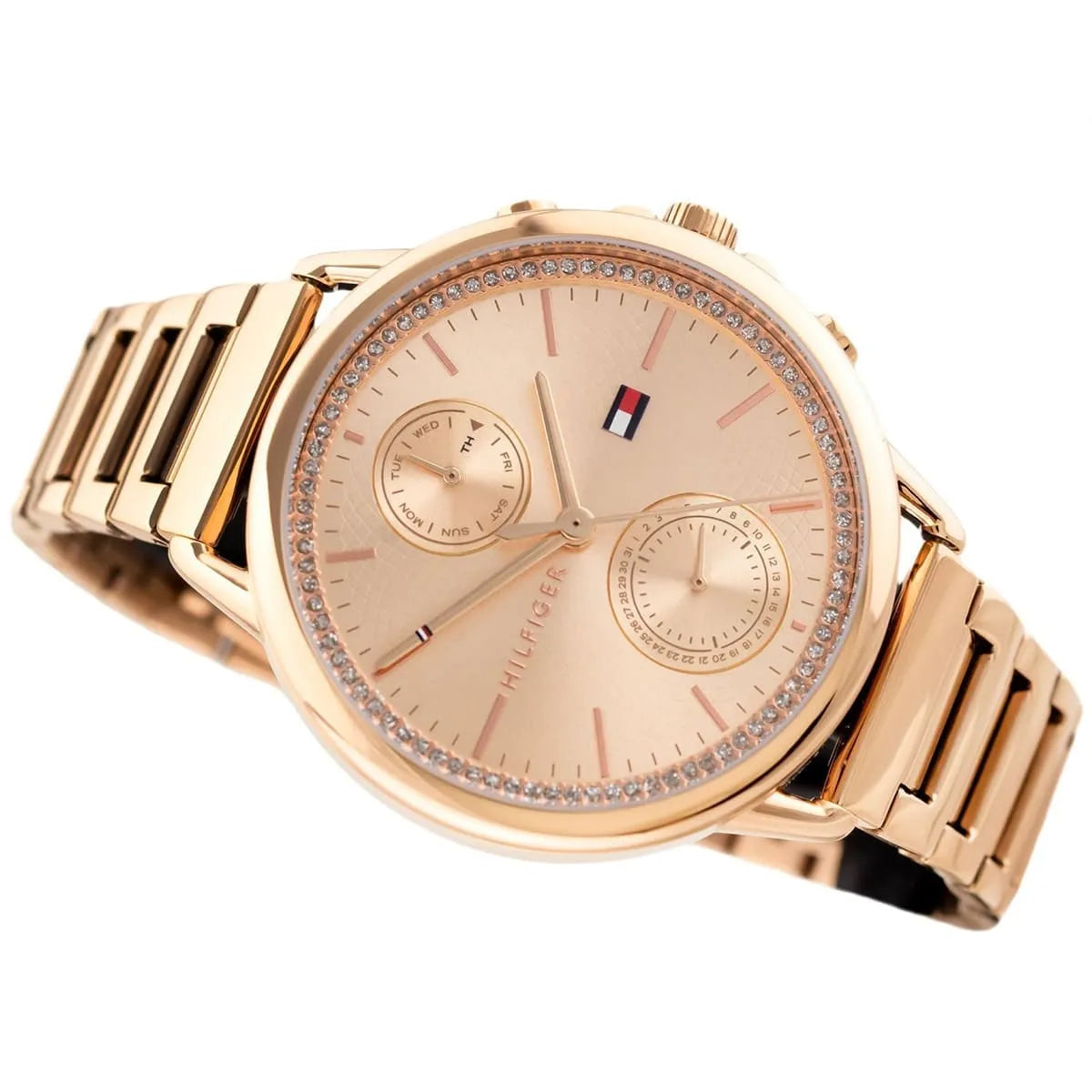 Side profile of Tommy Hilfiger women's rose gold watch with dual subdials and link bracelet