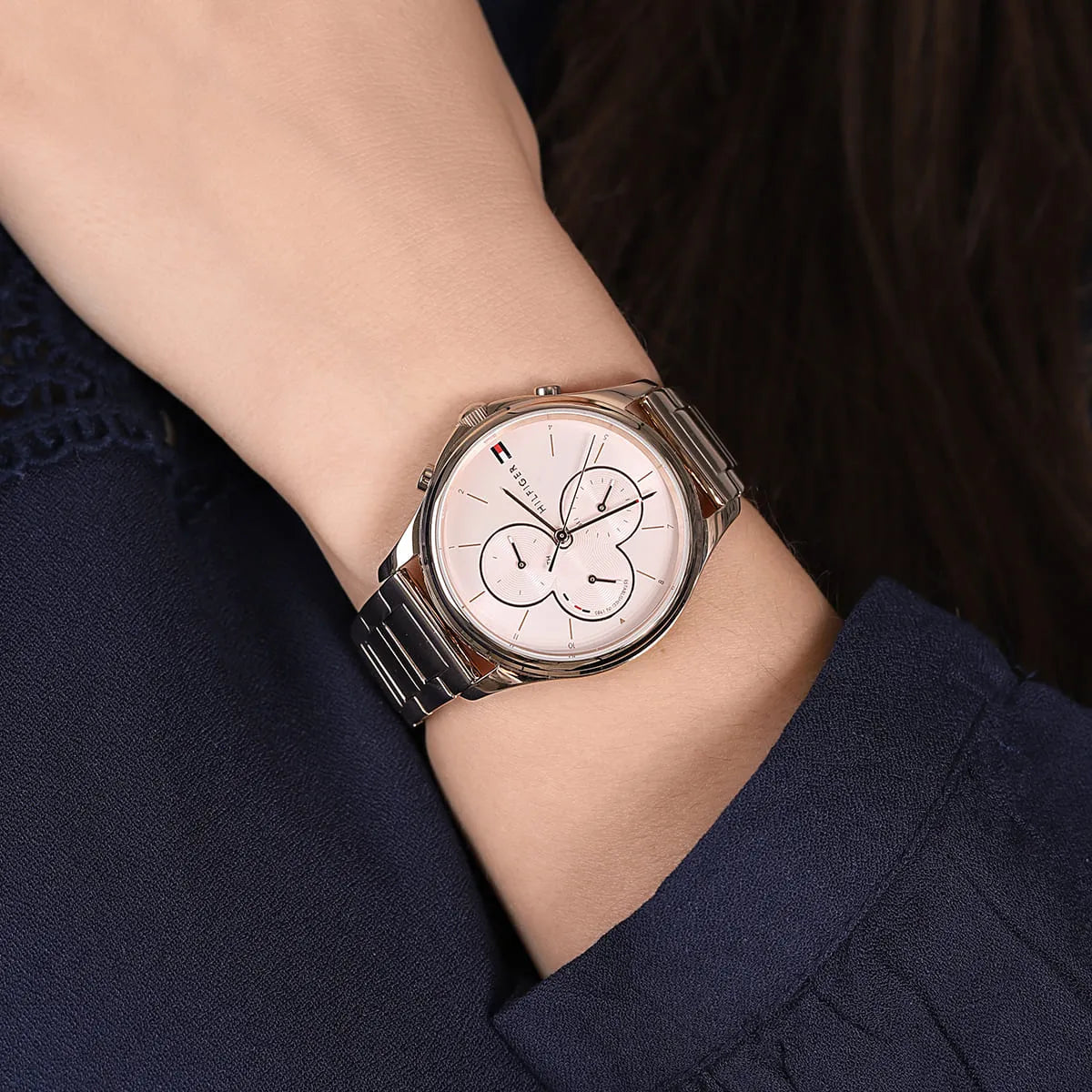 Tommy Hilfiger Skylar chronograph watch on wrist with rose gold case and bracelet