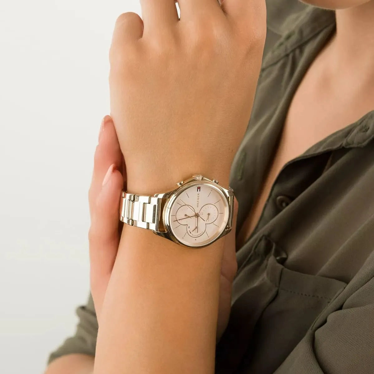 Tommy Hilfiger Skylar women's watch on wrist showing rose gold dial and metal strap