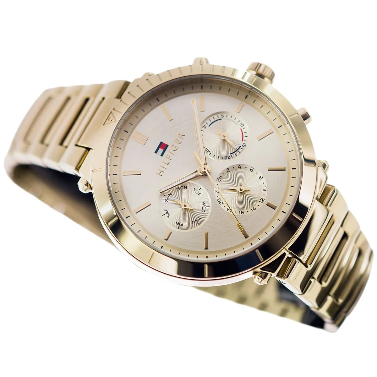 Tommy Hilfiger Emery chronograph watch at angle showing gold case and cream dial