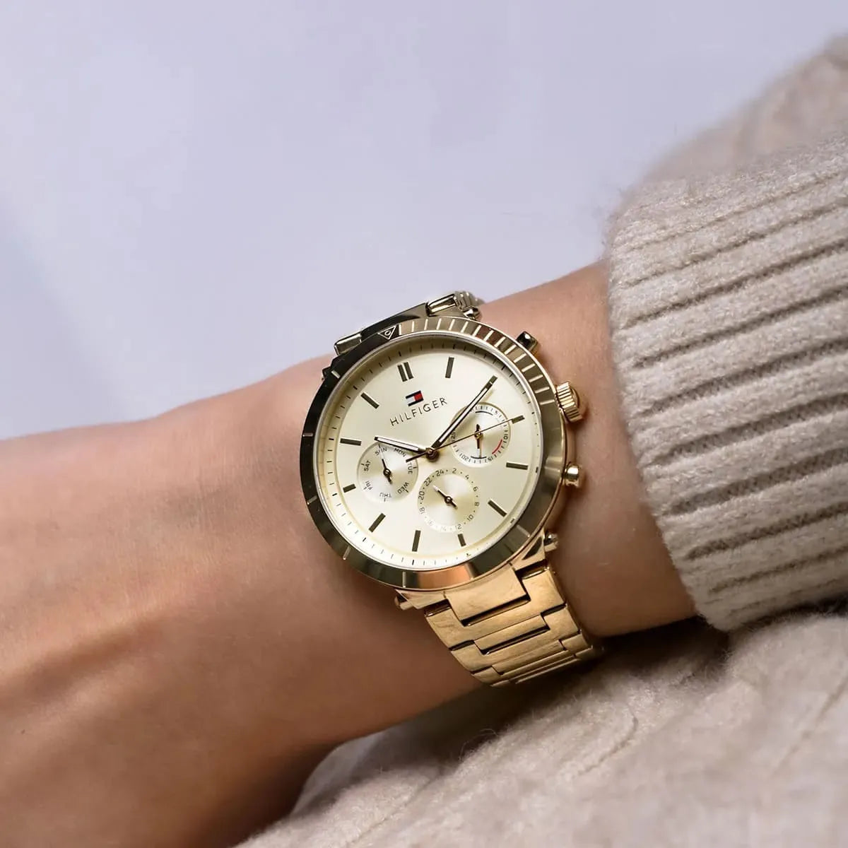 Tommy Hilfiger Emery gold chronograph watch on wrist with cream dial