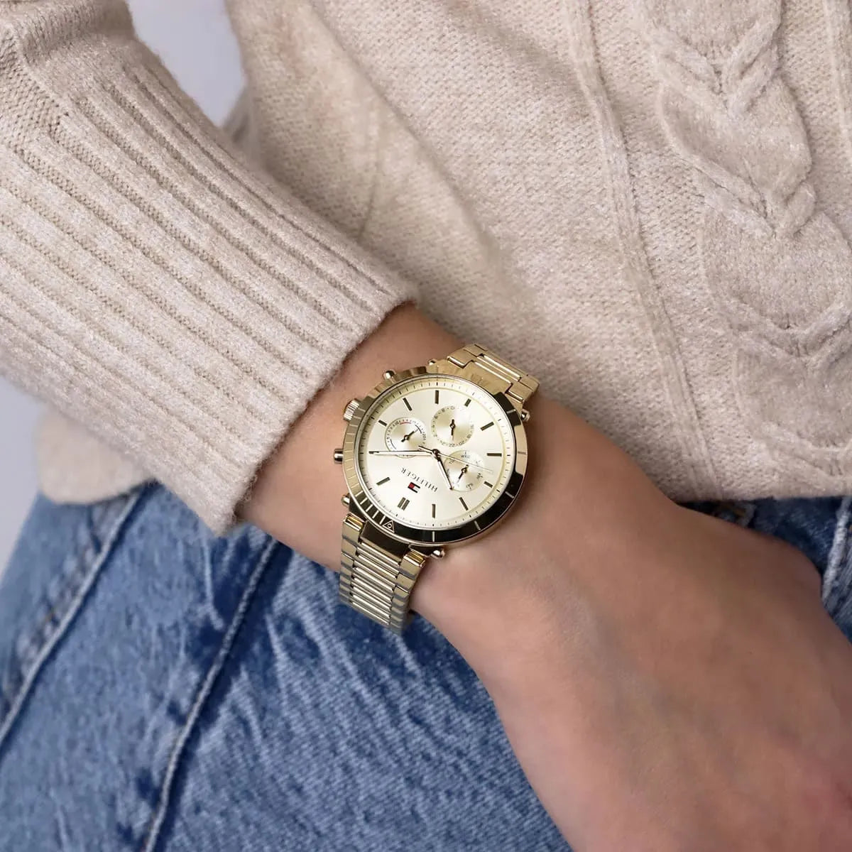 Tommy Hilfiger Emery gold watch on wrist with three chronograph subdials