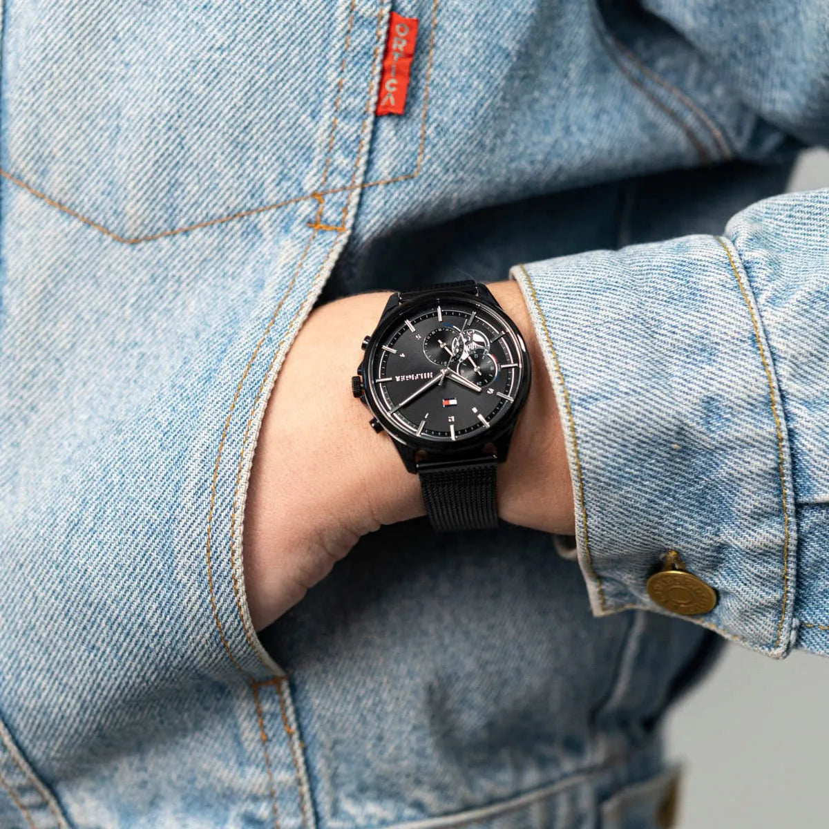 Tommy Hilfiger Quinn women's watch styled on wrist over denim
