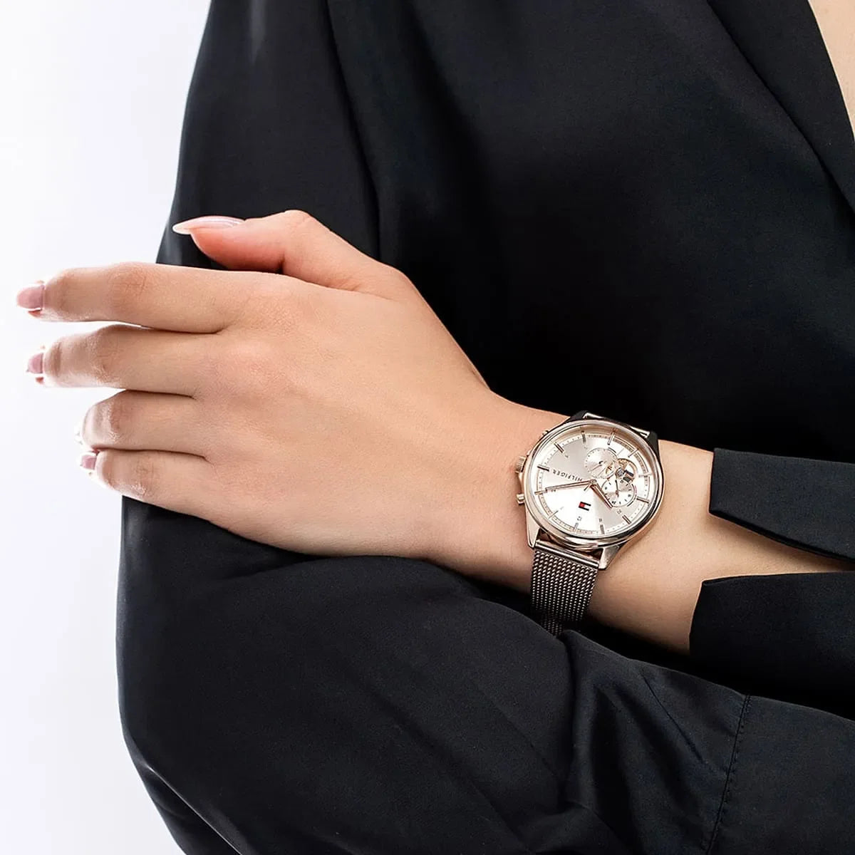 Rose gold Quinn women's watch worn on wrist with mesh strap