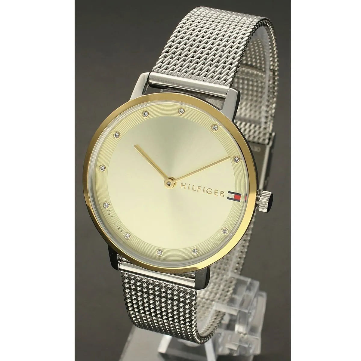 Tommy Hilfiger watch side view showing champagne dial with gold accents and mesh strap