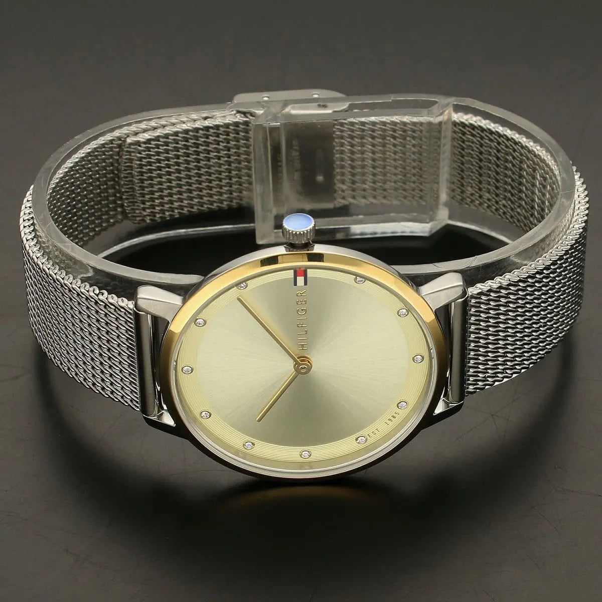 Tommy Hilfiger stainless steel mesh bracelet with adjustable clasp on champagne dial watch