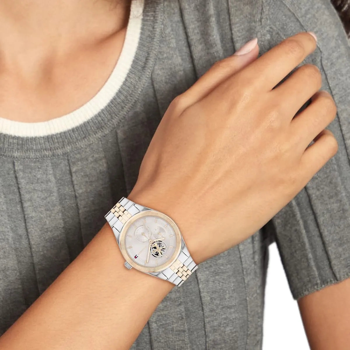 Tommy Hilfiger Monica watch on wrist showing day-date complications and two-tone bracelet styling