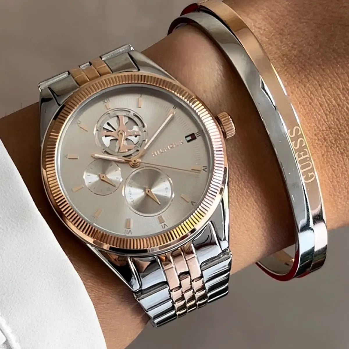 Tommy Hilfiger Monica watch worn on wrist with matching bracelet, bicolour design with grey dial